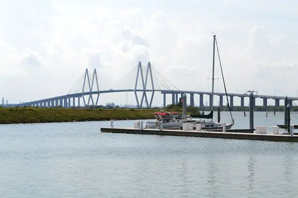 Fred Hartman Bridge over the water near Baytown, Texas, with a small marina in front
