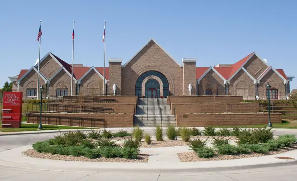 Brick museum building with a landscaped plaza in the Czech Village area of Cedar Rapids, Iowa